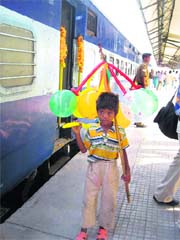 A child sells balloons at the Sirsa railway station.