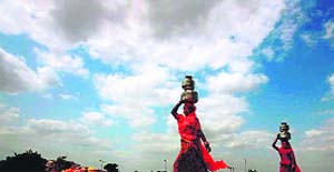 Women on their way home after fetching water in Faridabad. 