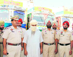 The accused nabbed for stealing trucks in police custody in Ludhiana on Thursday.