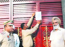 The DEO and police officials put up a notice on the admn block of Pothohar Sayad Khalsa Senior Secondary School at Field Gunj on Thursday.