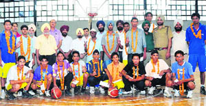 Players of the Punjab team, which won the national youth basketball championship held at Tiruchirapalli recently, pose after being honoured at a function in Ludhiana.
