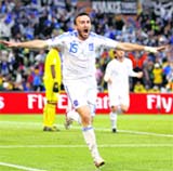 Greeces defender Vasilis Torosidis celebrates after scoring during their match against Nigeria in Bloemfontein on Thursday.