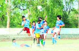 Player vie to take control of the ball during a match of the Dehradun Football League played at the Police Lines in Dehradun
