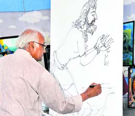 Delhi-based artist BL Rahi paints a portrait of King Bhagirath at the art exhibition on Ganga ghats in Haridwar
