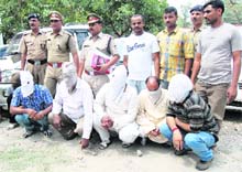 Members of a gang of vehicle thieves in police custody in Dehradun. 