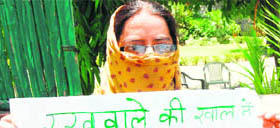 The Yamunanagar advocate, complainant in the MS Ahlawat case, stages a protest over inaction on her complaint in Chandigarh on Friday.
