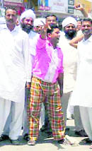 Villagers block traffic near Jiwan Nagar village in Sirsa on Friday. 