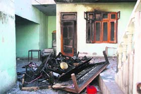 A partially damaged and burnt house of accused Darbinder Singh at Nai Basti in Jammu