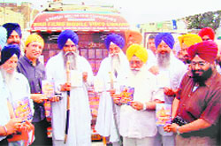 Punjab Public Relations Minister Sewa Singh Sekhwan inaugurates the Sikh Films Mobile Video Library in Amritsar on Friday. Also seen in the picture are the Akal Takht Jathedar, Giani Gurbachan Singh, the Head Granthi of the Golden Temple, Giani Jaswinder Singh, and film-maker Mangal Dhillon.