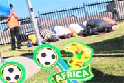 A group of Muslim football supporters prays at a park near Soccer City Stadium in Soweto, suburban Johannesburg