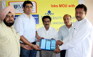Malwa College officials receiving the MoU.