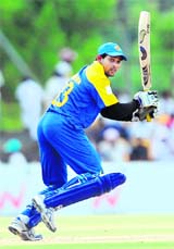 Sri Lankas Tillakaratne Dilshan plays a stroke during the third ODI of the Asia Cup between Sri Lanka and Bangladesh in Dambulla on Friday.