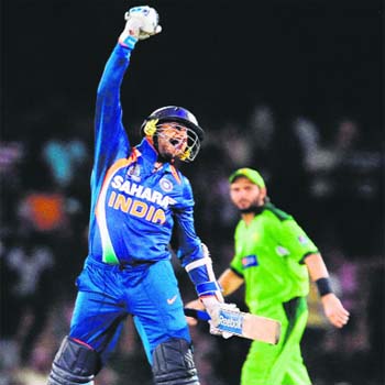 Harbhajan Singh celebrates victory as Pakistan captain Shahid Afridi looks on after the fourth ODI of the Asia Cup between India and Pakistan in Dambulla on Saturday.