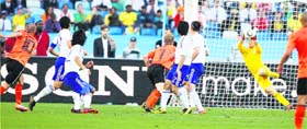 Japenese goalkeeper Eiji Kawashima unsuccessfully tries to save a shot from Netherlands Wesley Sneijder on Saturday.
