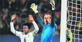 Australia's goalkeeper Mark Schwarzer (R) and Ghana's Anthony Annan raise their hands at the Royal Bafokeng stadium in Rustenburg on Saturday.