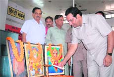 Dehradun Mayor Vinod Chamoli inaugurates a convention of the Bharatiya Mazdoor Sangh in Dehradun on Sunday