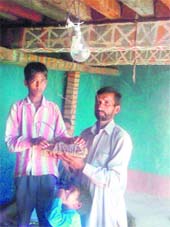 Mushtaq along with his father demonstrates his invention.