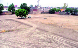 Partly completed development work on an 8-acre illegal colony along the GT road (NH-1) in Ludhiana