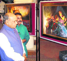 Chief Minister Prem Kumar Dhumal at the inauguration of a painting exhibition by IS Grover at the Gaiety Theatre in Shimla on Monday.