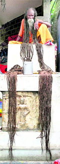 A sadhu shows his long hair at Kamakhya Temple in Guwahati on Monday