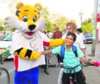 Shera shakes hands with a boy at an intersection in Amritsar on Monday.