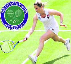   Belgiums Kim Clijsters returns a shot to Italys Maria Elena Camerin at the Wimbledon Championships in London on Monday.