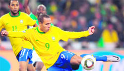 Brazils striker Luis Fabiano (R) shoots and scores during their match against Ivory Coast in Johannesburg on Sunday.