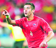Chiles Mauricio Isla celebrates after Chiles striker Mark Gonzalez (unseen) scored the winner against Switzerland in Port Elizabeth on Monday.