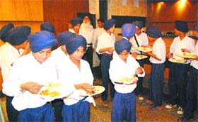 Inmates of Central Khalsa Orphanage, run by the Chief Khalsa Diwan, have meals at a newly inaugurated 4-star hotel in Amritsar
