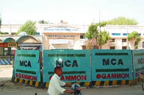 The space in front of the All-India Pingalwara Charitable Society is covered with tin sheets for raising a pillar for an elevated road