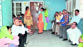 Patients line up in front of the OPD at Mandi zonal hospital.