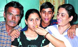Heena being greeted by their parents.