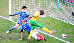South Africas striker Katlego Mphela (R) scores a goal during the Group A first round World Cup match between France and South Africa in Bloemfontein