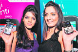 Models display new mobile phones launched by MVL in New Delhi 