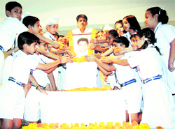 Students of Air Force School, Satwari, pay tributes to Shalin Gupta, who was also a student of the school, in Jammu on Wednesday