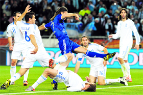 Argentinas defender Martin Demichelis (C) shoots to score the opening goal during the Greece vs Argentina match in Polokwane on Tuesday