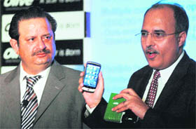 Arun Khanna (L), chairman of Olive Telecommunication along with Anil Sardana, managing director of Tata Teleservices Ltd., at the launch of Olive mobile phones in Mumbai on Thursday. 