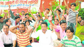 Roadways staff along with their members of their families hold a protest in Dehradun on Thursday.