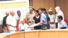 Haryana Governor Jagannath Pahadia hands over appointment letters to students appointed by various companies at the Deenbandhu Chhotu Ram University of Science and Technology, Murthal, on Thursday.