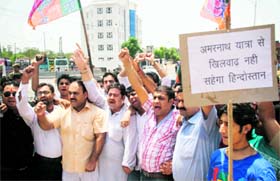 Members of the BJYM protest at Maheshpura Chowk in Jammu on Thursday.