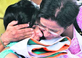 Preeti Sood, wife of Colonel Neeraj Sood, who was killed in an encounter in Kupwara, being consoled by her mother at the Brar Square Armed Forces Cremation Ground in New Delhi