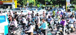 Vehicles queue up at a petrol station in Chandigarh on Friday.