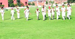 Budding cricketers practise at the playground of GMSSS, Sector 26.