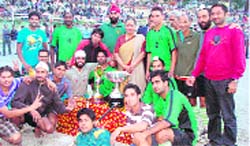 Uttarakhand Governor Margaret Alva with the winner FCI, Noida, team at the All-India Traders Hockey Cup in Nainital on Friday.