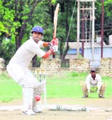 A batsman faces a delivery during a match at the Challenger Cup Cricket Tournament in Dehradun on Friday.