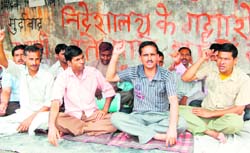 Sacked Ayurvedic employees stage a protest in Dehradun on Friday. 