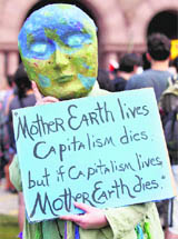 An  activist  protests against the G8 and G20 Summits, in Toronto on Thursday.