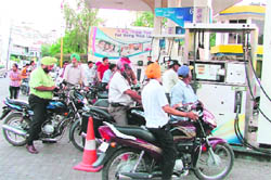 Two-wheelers queue up at a petrol station in Ludhiana