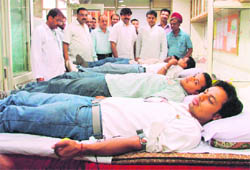 Youths donate blood during a camp at PTU learning centre in Ludhiana