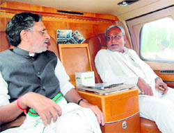 BJP leader Sushil Modi (L) with BIhar CM Nitish Kumar during the last leg of his Vishwas Yatra in Patna on Friday